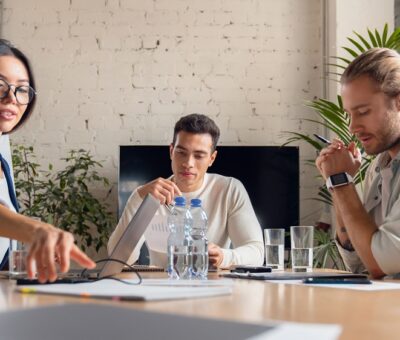 Business people discussing new project in office. Team of business professionals having a meeting in conference room.