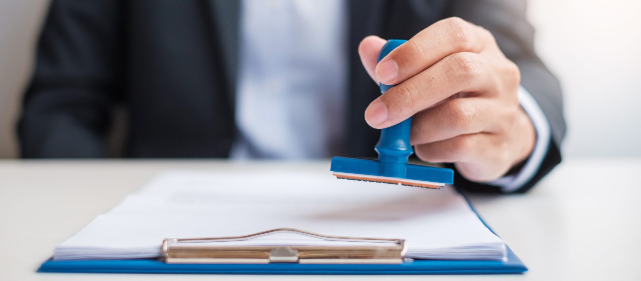 Businessman stamp during signing contract document.Business cont